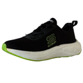 Black sneaker with green sole on a white background