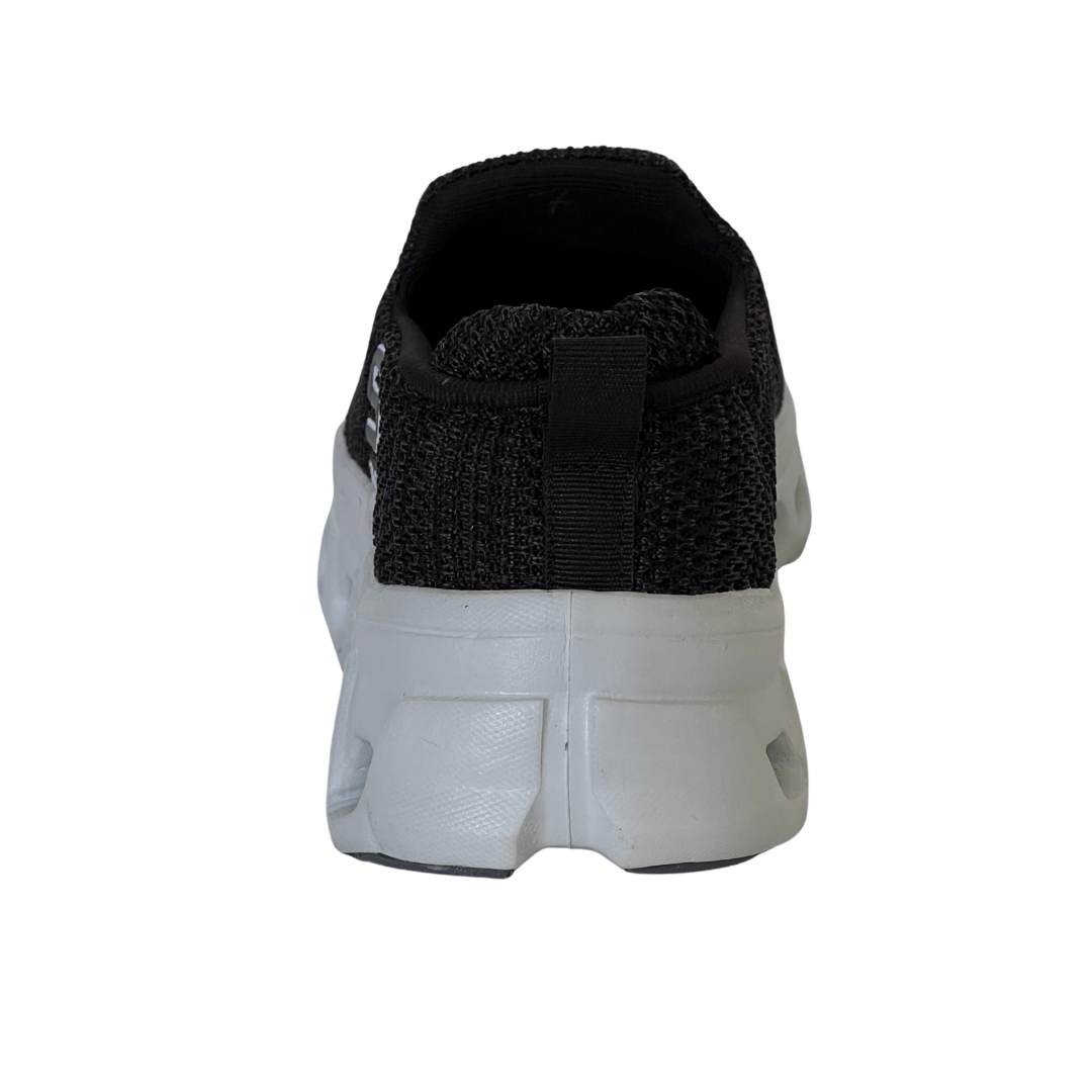 Back view of a white sneaker with black sole on a white background