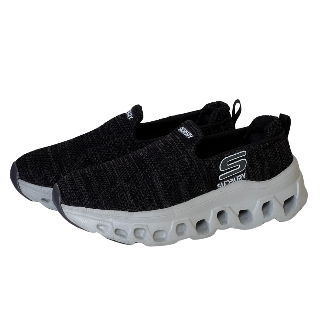 Black sneakers with white sole on a white background